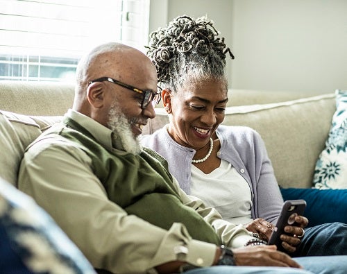 Senior couple donating