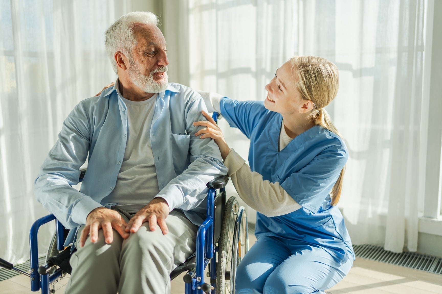 Caregiver with Patient in Wheelchair